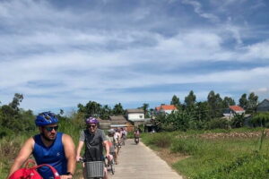 Half-Day My Son Sanctuary Bike Tour from Hoi An - Stop 1: Hoi An riverfront photos, plus an easy way to leave the center behind