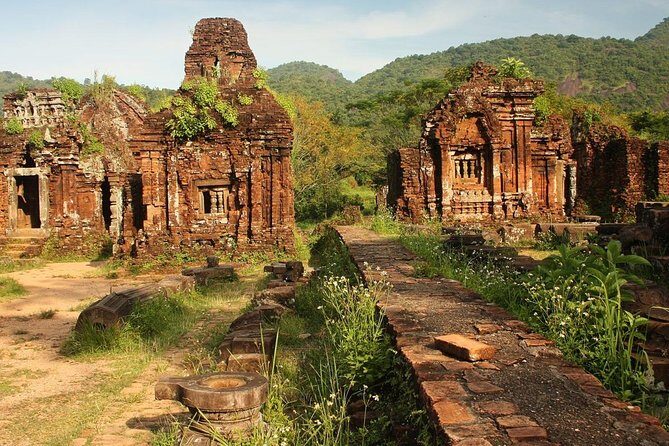 My Son Sunset Tour With Boat Trip - Entering My Son Sanctuary: brick towers, walking, and context